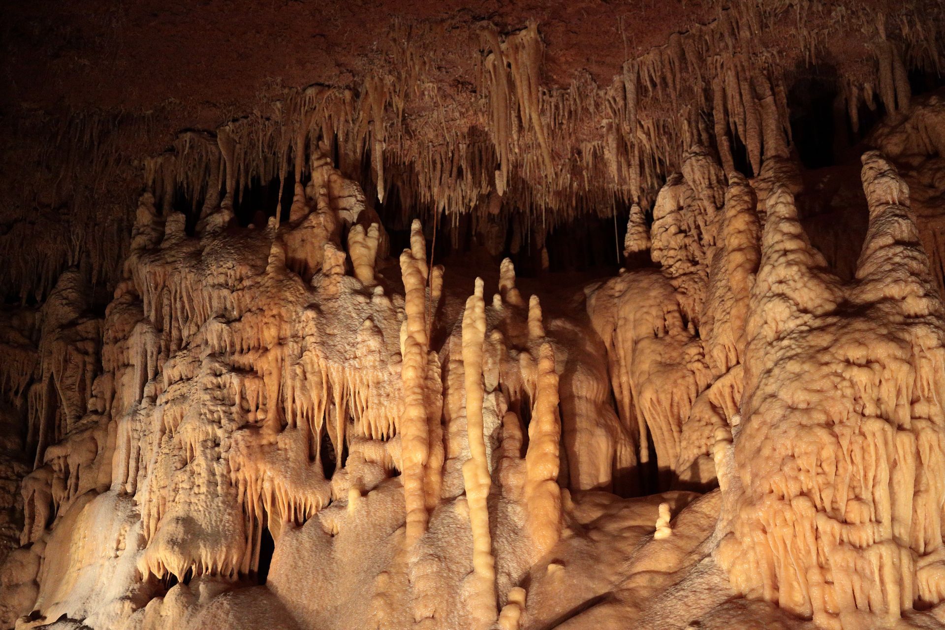 A cave filled with lots of rock formations and stalagmites