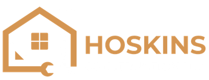 A logo for hoskins with a house and a wrench.