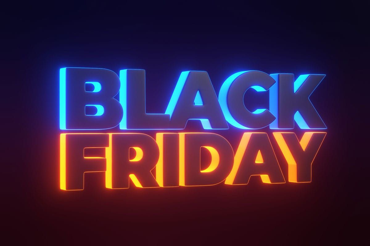 A neon sign that says black Friday on a dark background