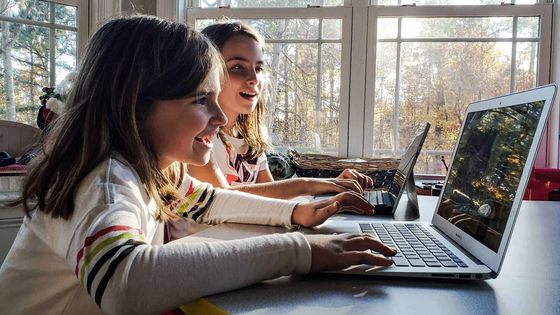 Photo of girls using computers.