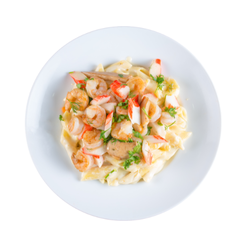 A plate of pasta with shrimp and crab sticks on a white background.