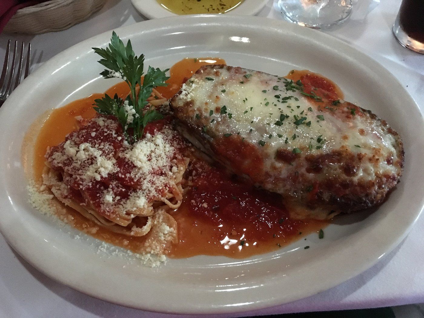 A plate of food with meat and sauce on a table
