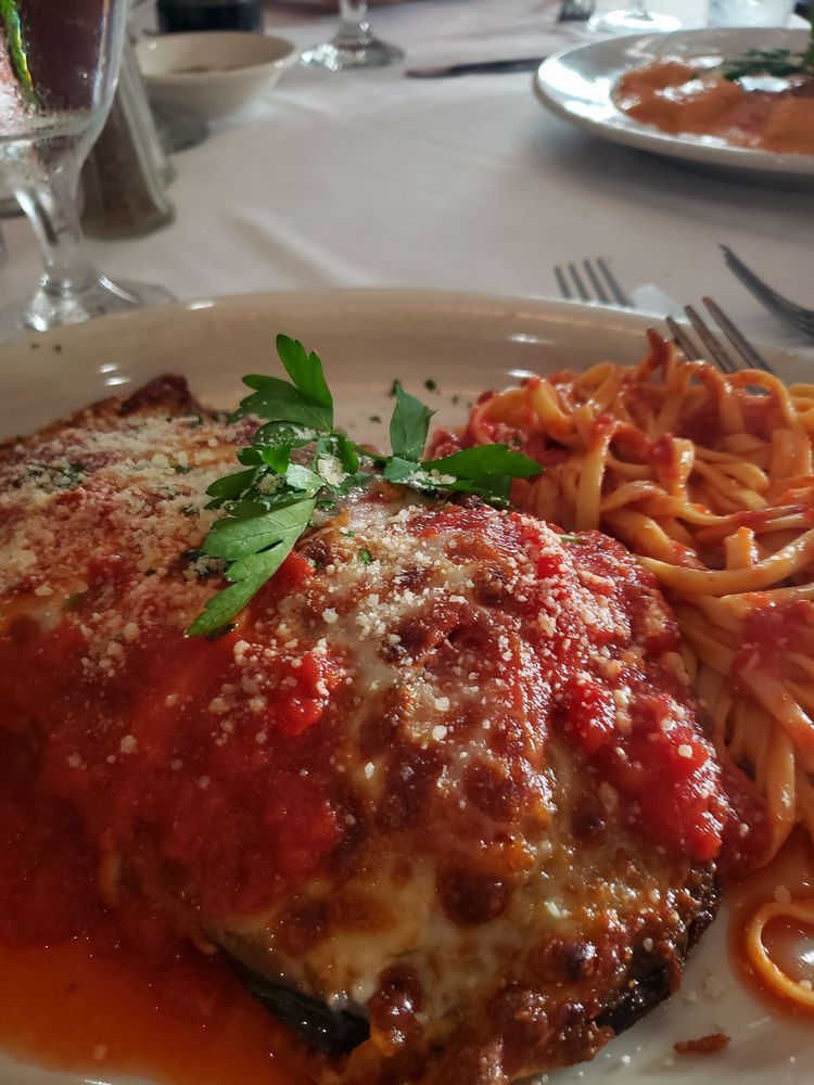 A close up of a plate of food with spaghetti and meat