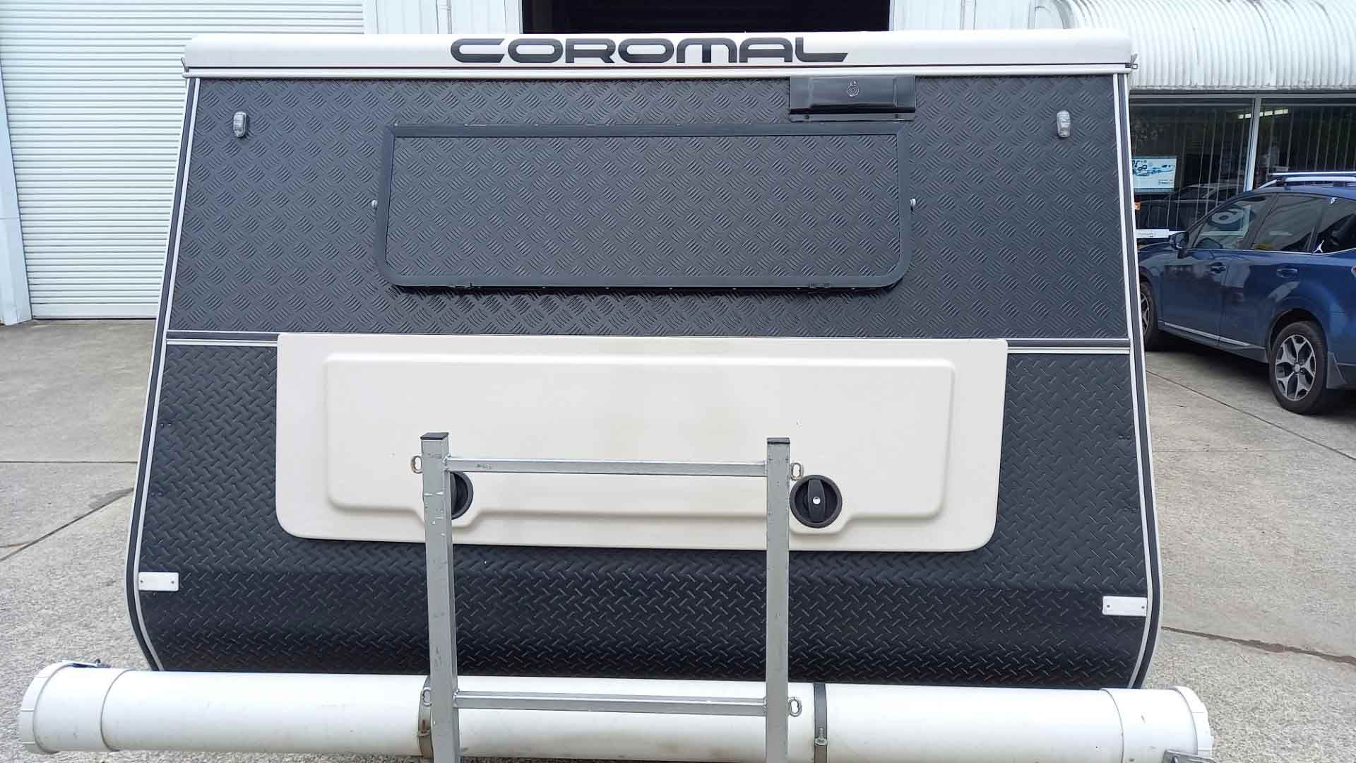 A White Air Conditioner Is Hanging From The Ceiling — Lake Macquarie Caravan Repairs In Cardiff, NSW