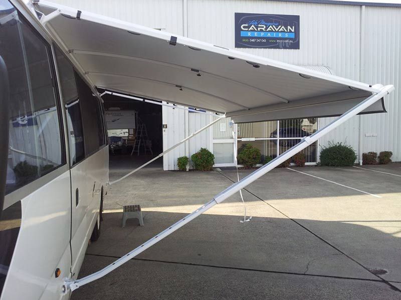 A White Caravan With Awnings Open — Lake Macquarie Caravan Repairs In Cessnock, NSW