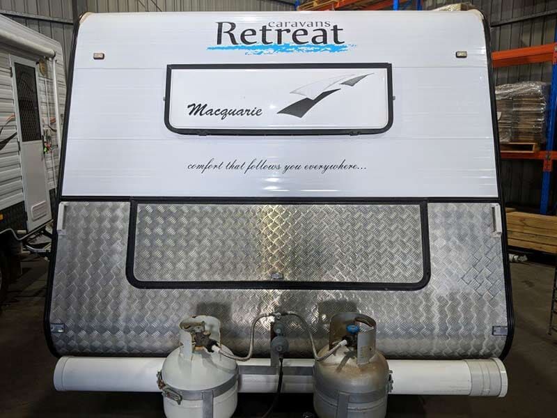 A Caravan With Two Propane Tanks Attached To It — Lake Macquarie Caravan Repairs In Port Stephens, NSW