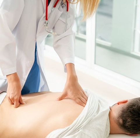 Doctor Examining Male Patient — Activator Method