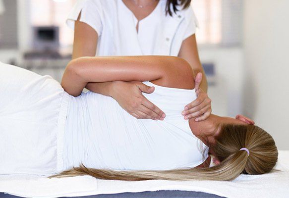 Physiotherapist Treating Patient — Chiropractor