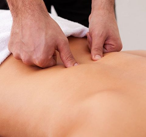 Chiropractor Performing Back Adjustment — Sacro-Occipital Technique