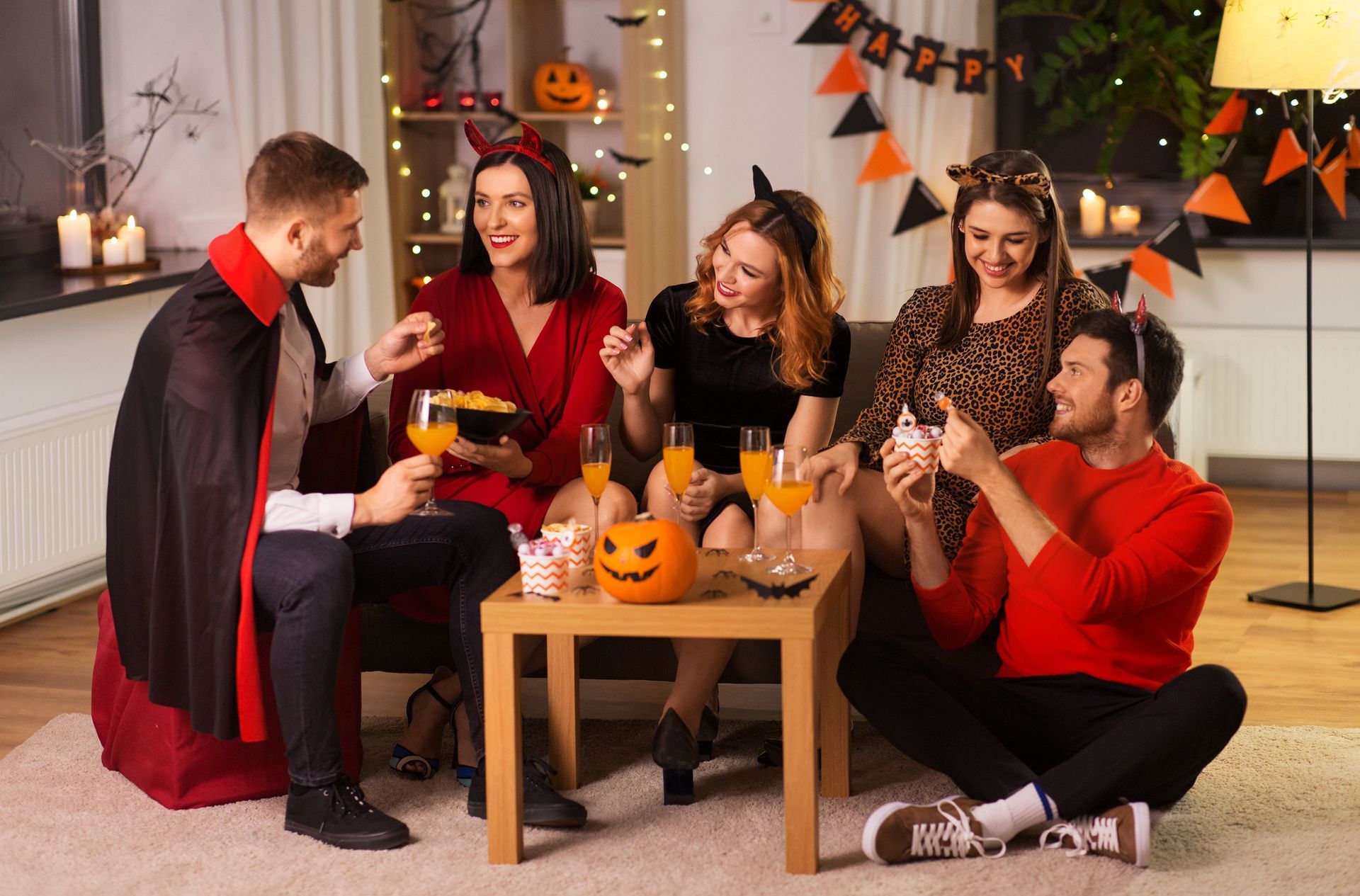 A group of friends enjoying the spooky holiday indoors with allergen-free Halloween treats