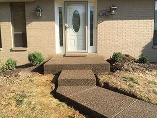 Home patio area overlooking beautiful landscaping—Custom Concrete & Concrete Services in Glenshaw, Pennsylvania