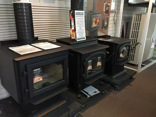 three fireplaces sitting close together in showroom at DWR services