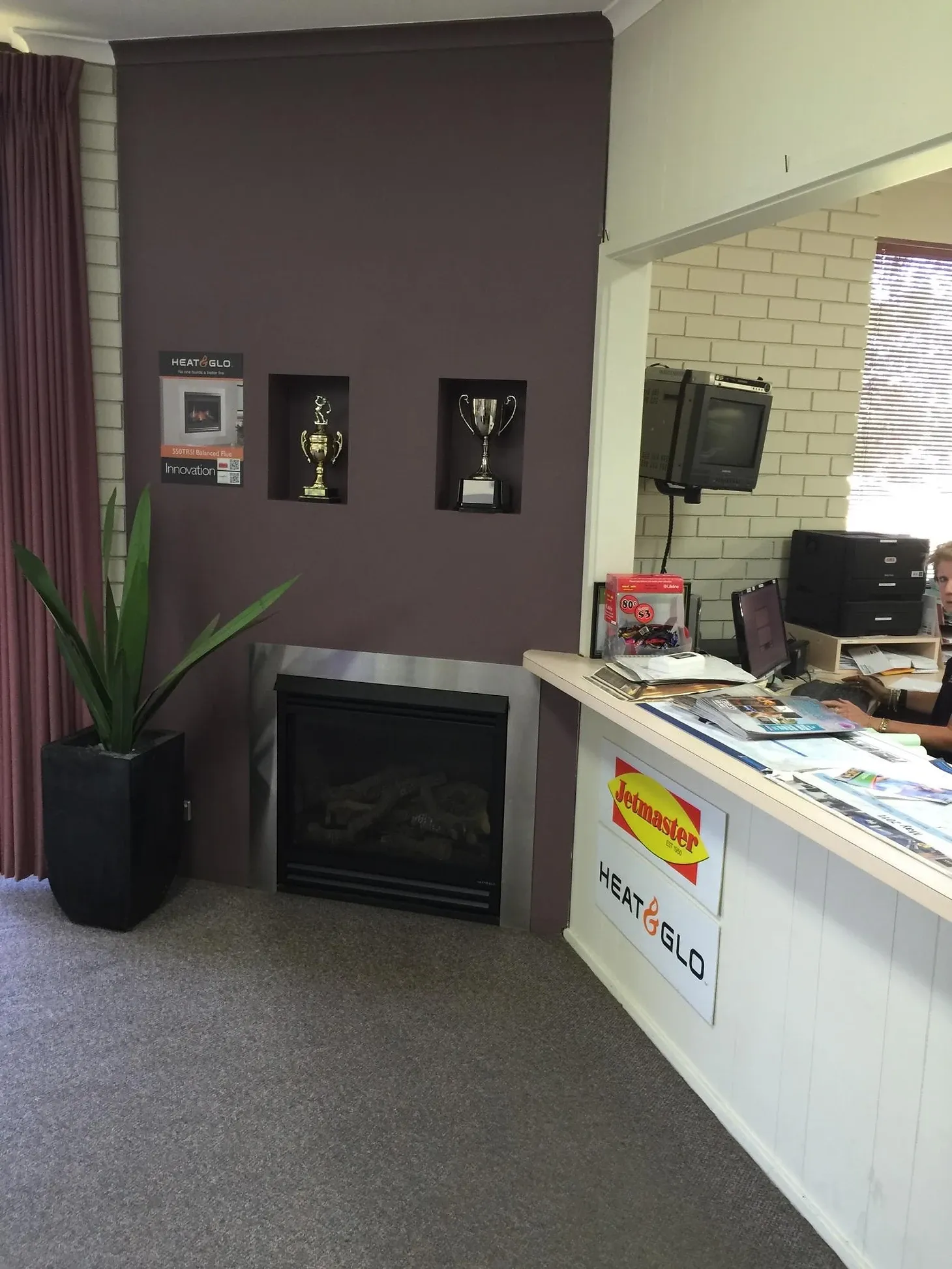 front desk at dwr services with fireplace built into wall to the left