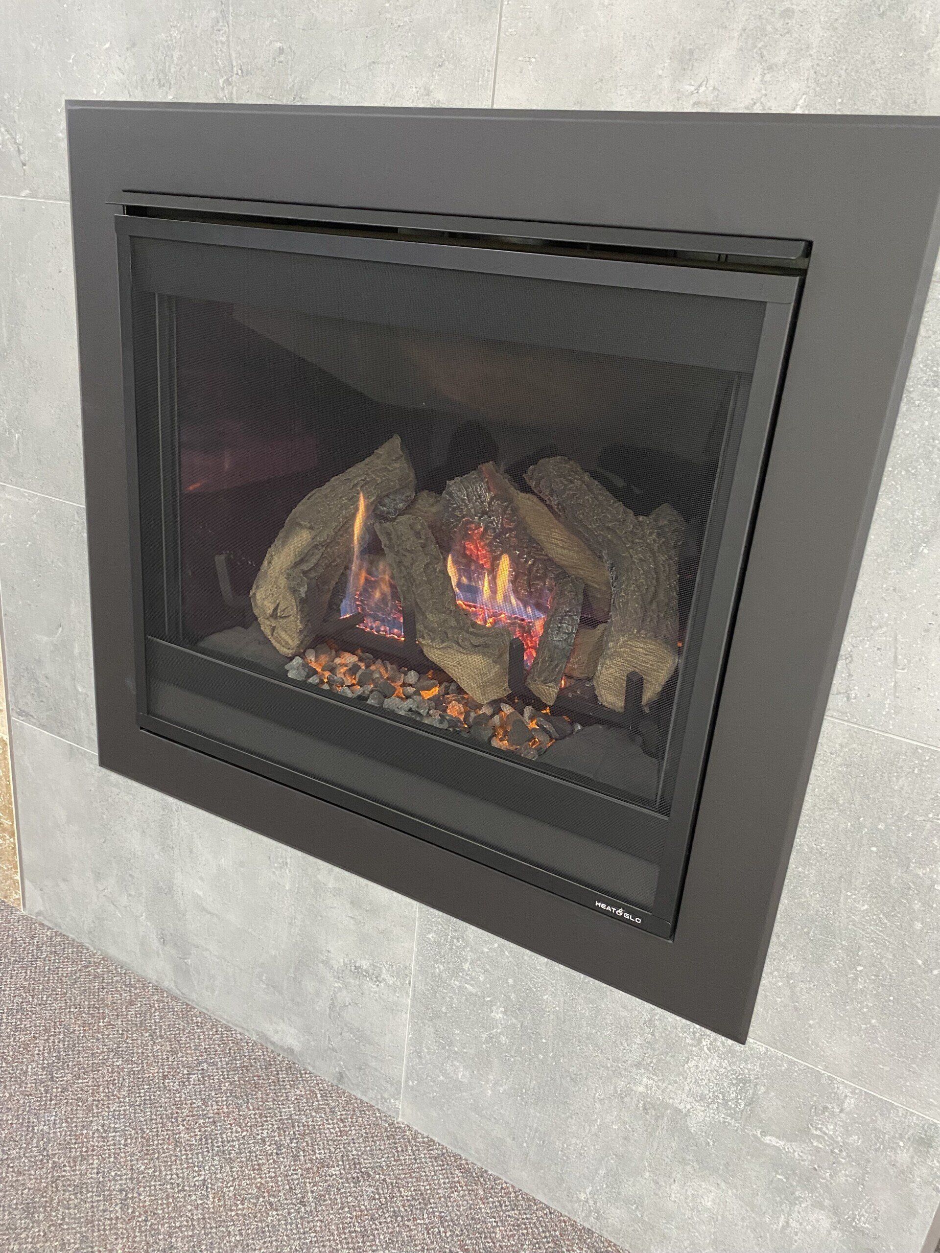 close up of fireplace built into tiled wall installed by dwr services