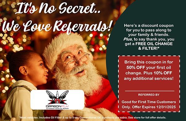 Santa with a child, offering a coupon for oil change services.
---