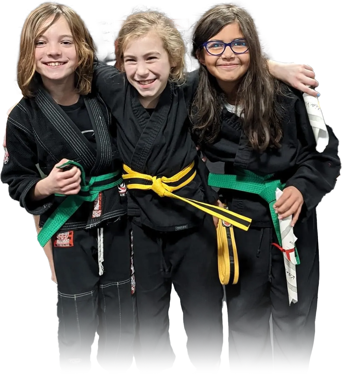 three young girls wearing black karate uniforms and green belts are posing for a picture .