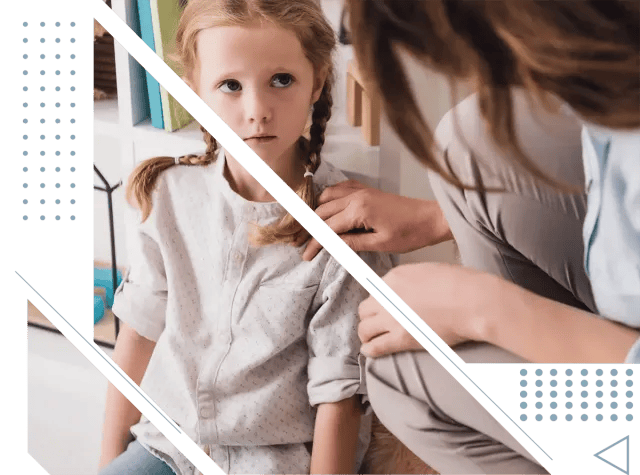 little girl looking worried with her mother by her side