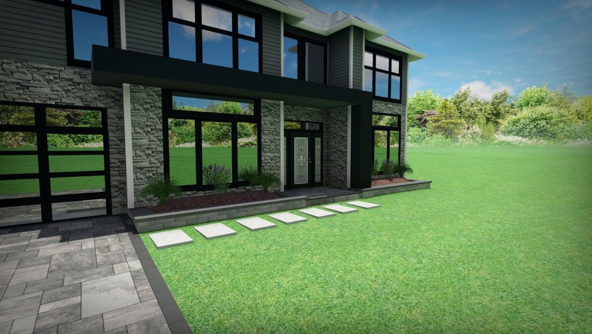 a large house with a lot of windows is sitting on top of a lush green field .