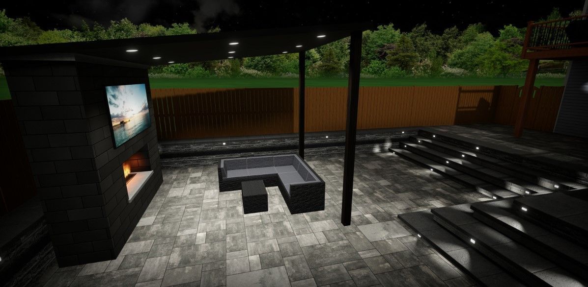 a patio with a fireplace and a television at night .