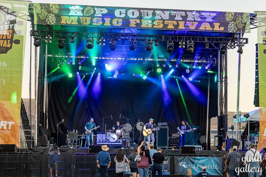 A band is on stage at the hop country music festival