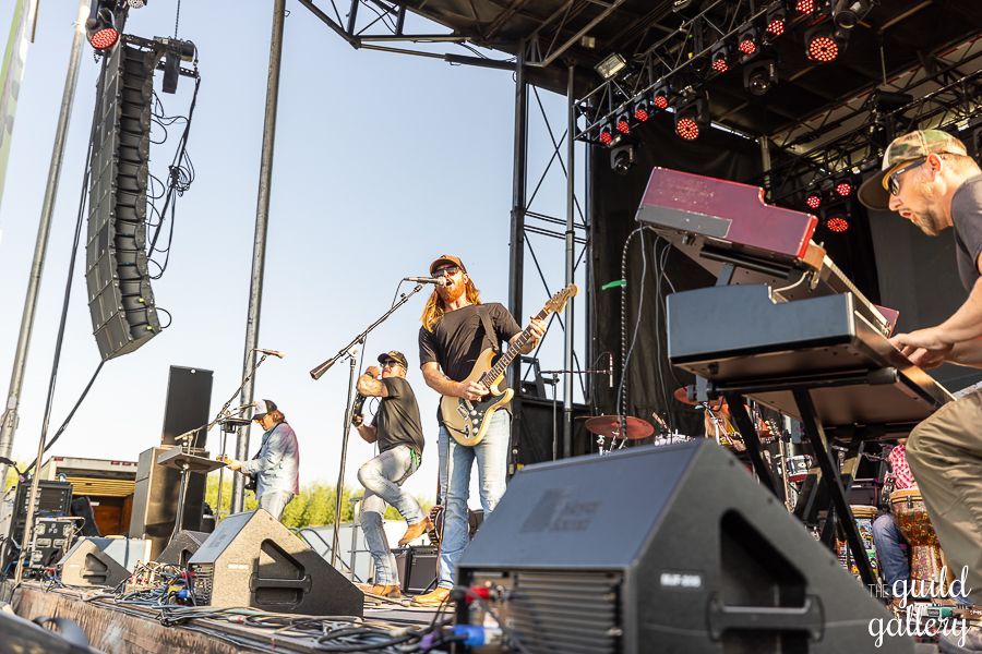 A group of people are playing instruments on a stage.