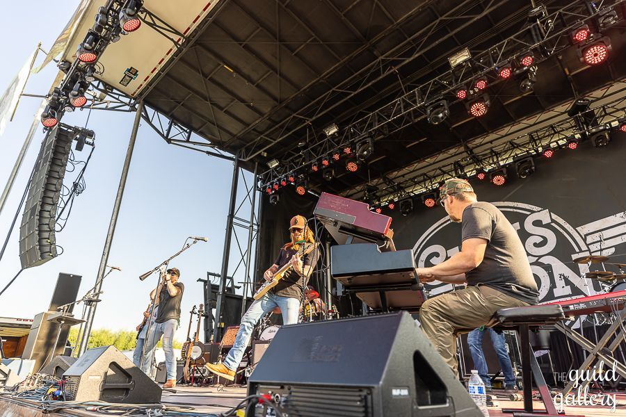 A group of people are playing instruments on a stage.