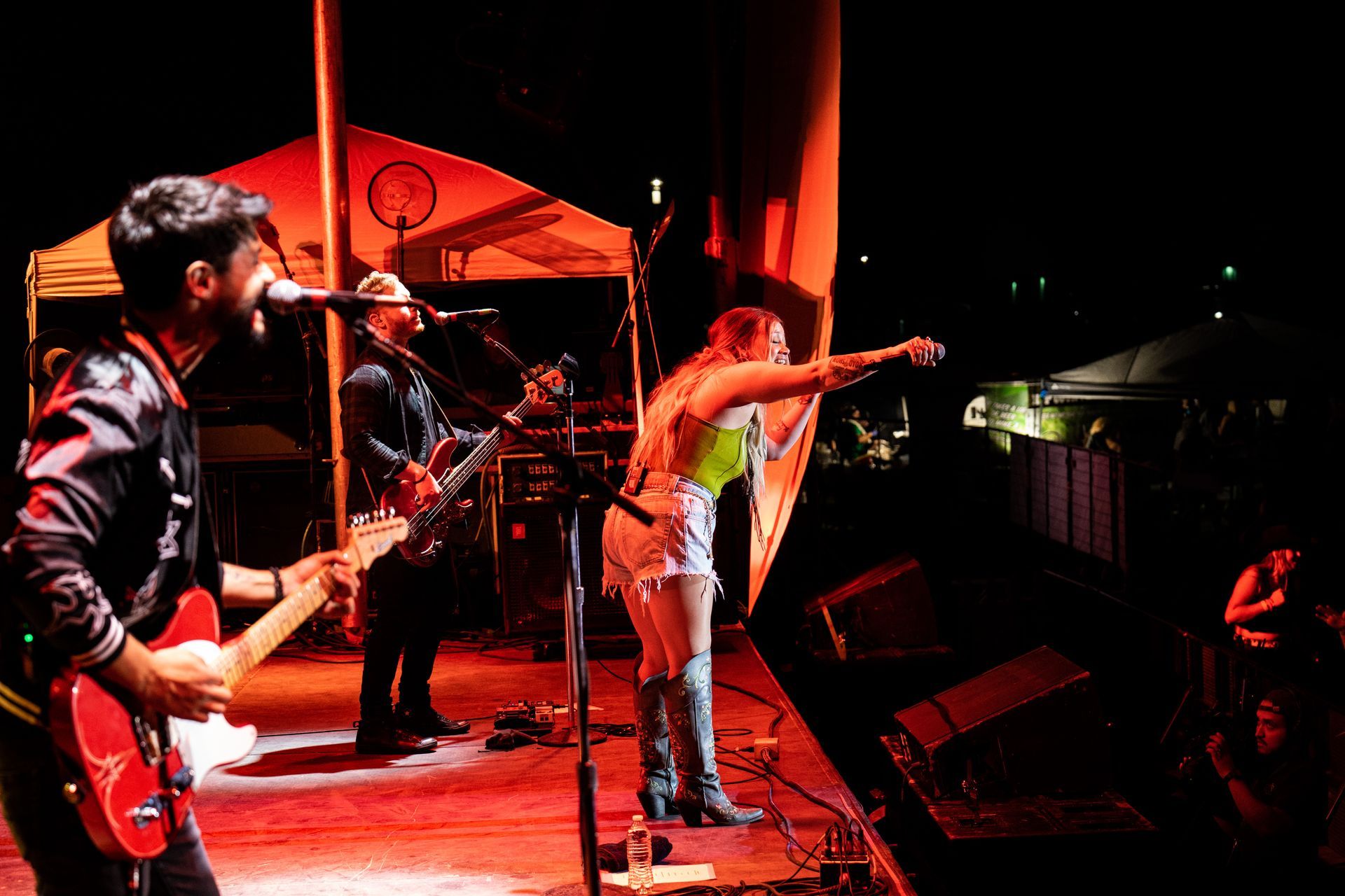 A group of people are playing instruments on a stage.