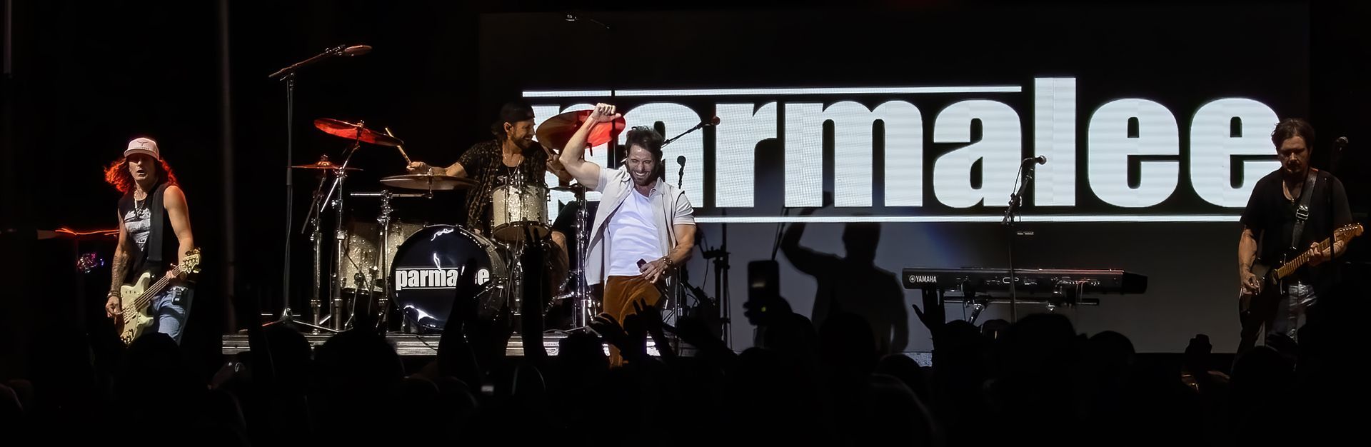 Parmalee band performing on stage in front of a crowd