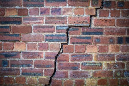 staircase crack in a red brick wall