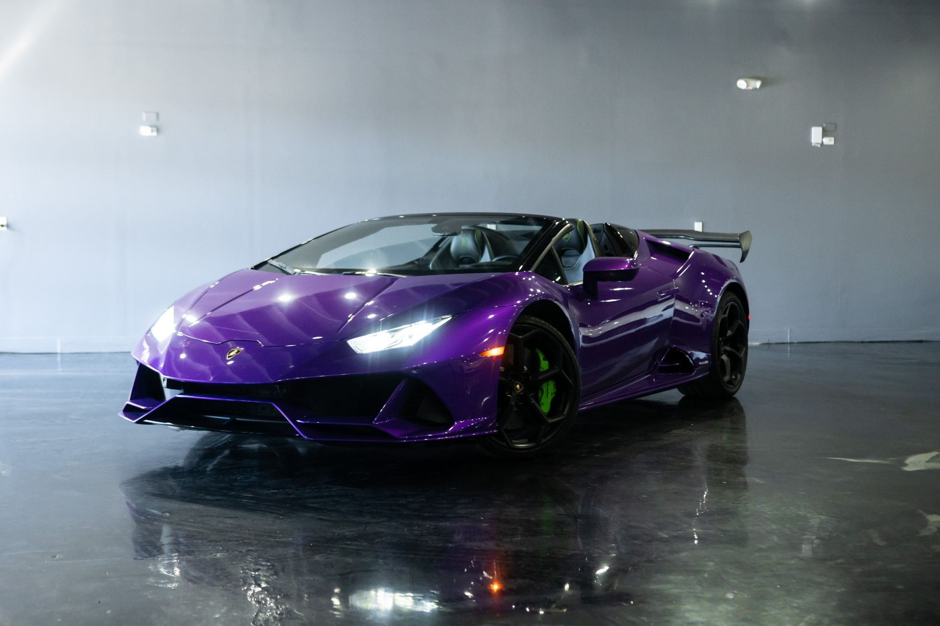 Purple Lamborghini Huracan convertible, interior shot.