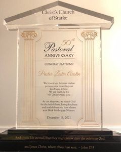 An acrylic award from Christ’s Church of Starke honoring Pastor Luter Austin’s 50th pastoral anniversary, dated Dec 19, 2021.