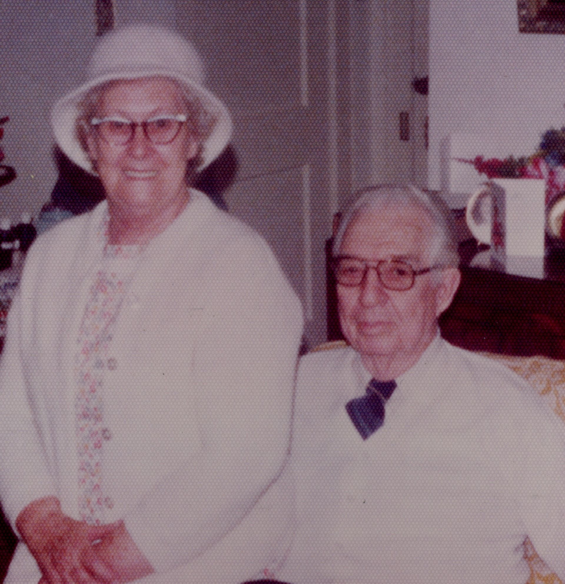 Brother & Mrs. Joe Parsons. She wears a light-colored hat and sweater; he wears a tie.