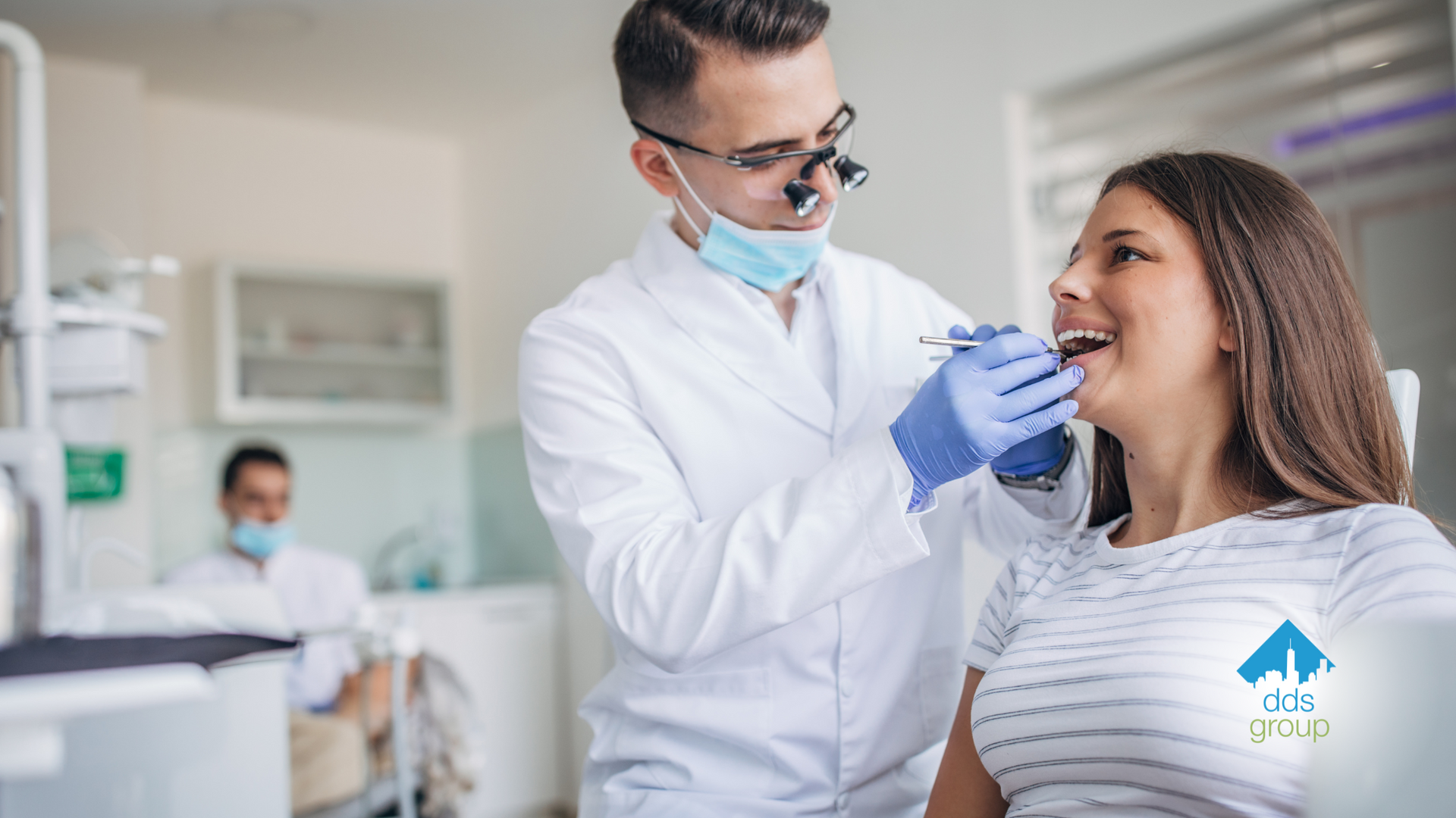 A dentist is examining a woman 's teeth in a dental office.