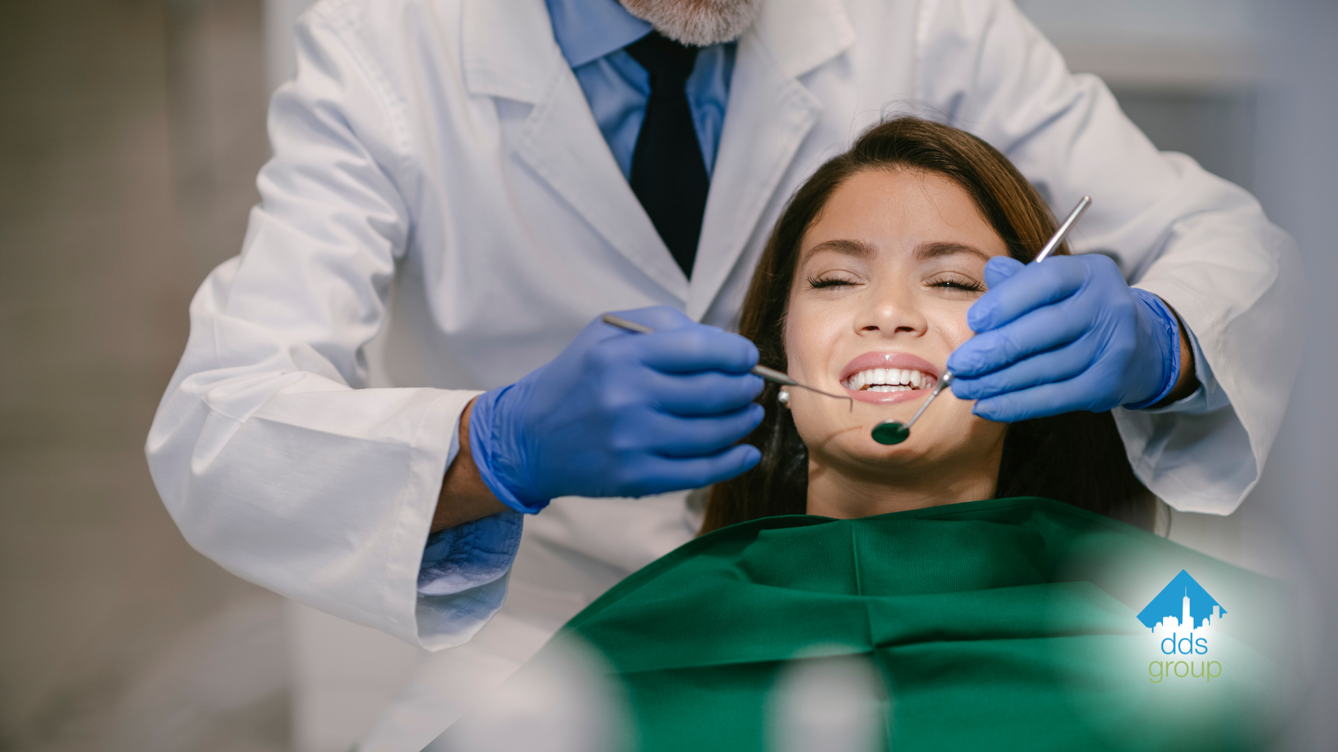 A dentist is examining a woman 's teeth in a dental office.