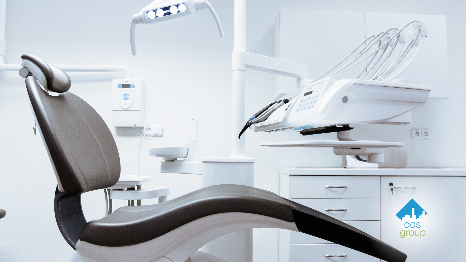 An empty dental chair in a dental office.
