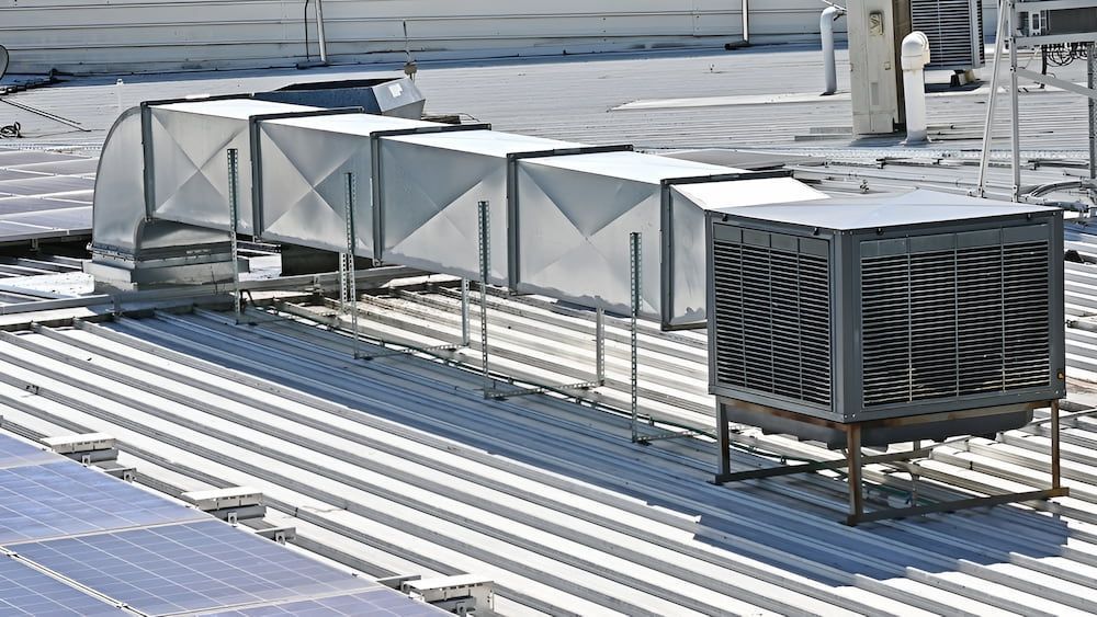 A Rooftop With A Lot Of Air Ducts On It — Keystone Engineering Sheet Metal Industries in Noosaville, QLD