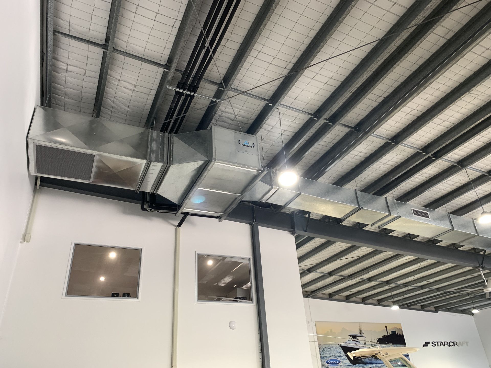 The ceiling of a building with a lot of pipes hanging from it. — Keystone Engineering Sheet Metal Industries in Noosaville, QLD