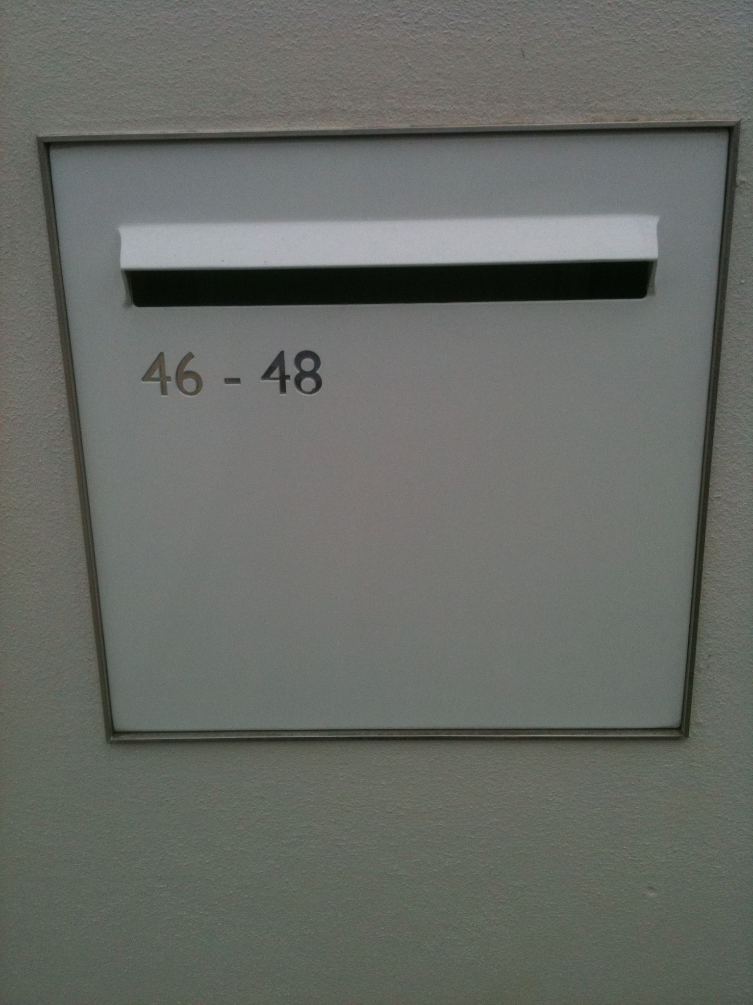 A white mailbox with the number 46 48 on it — Keystone Engineering Sheet Metal Industries in Noosaville, QLD