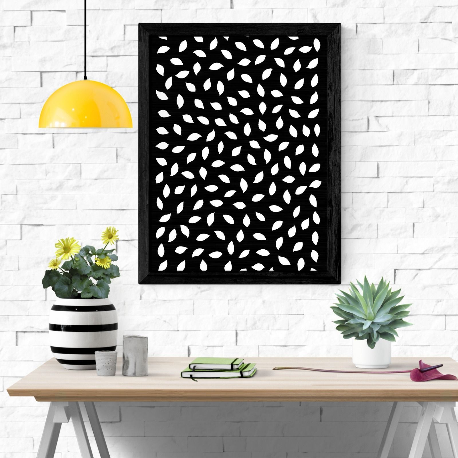 A black and white painting is hanging on a white brick wall above a wooden desk. — Keystone Engineering Sheet Metal Industries in Noosaville, QLD
