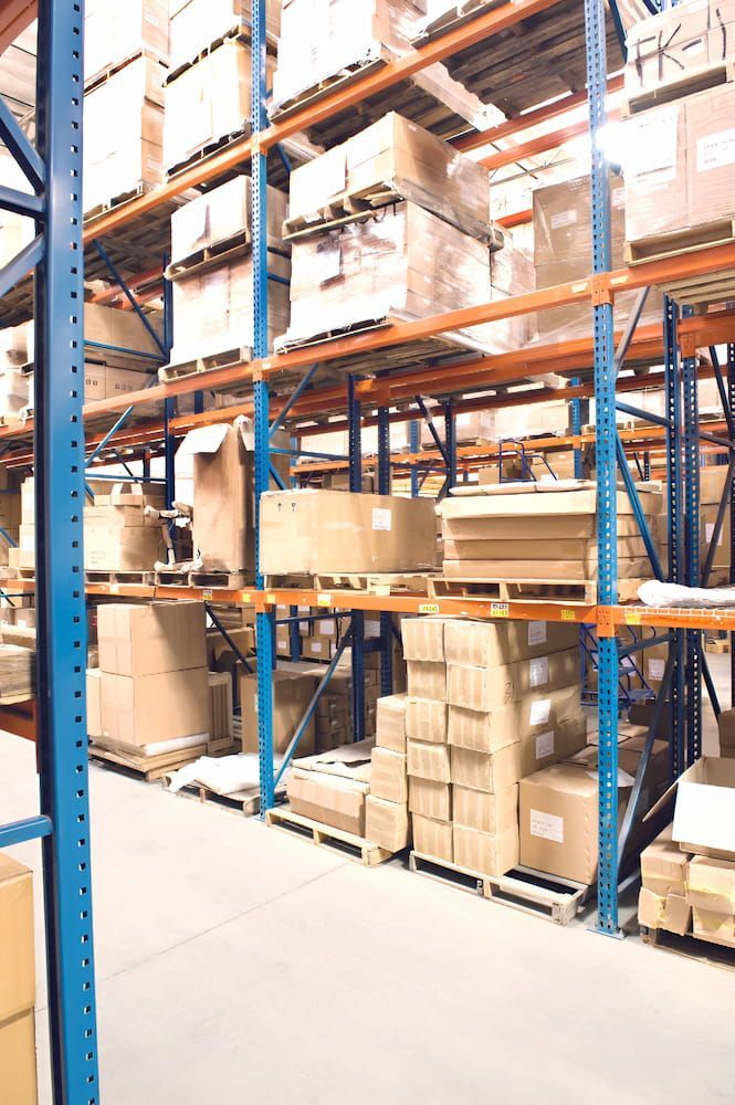 A Large Warehouse Filled With Lots Of Boxes And Shelves — Keystone Engineering Sheet Metal Industries in Noosaville, QLD