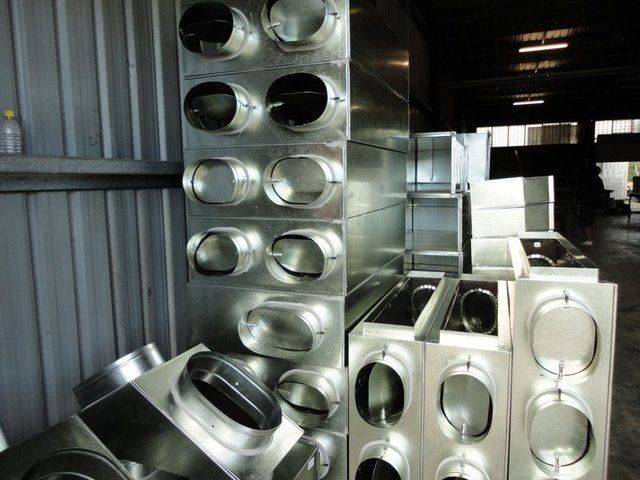 A bunch of metal pipes are stacked on top of each other — Keystone Engineering Sheet Metal Industries in Noosaville, QLD