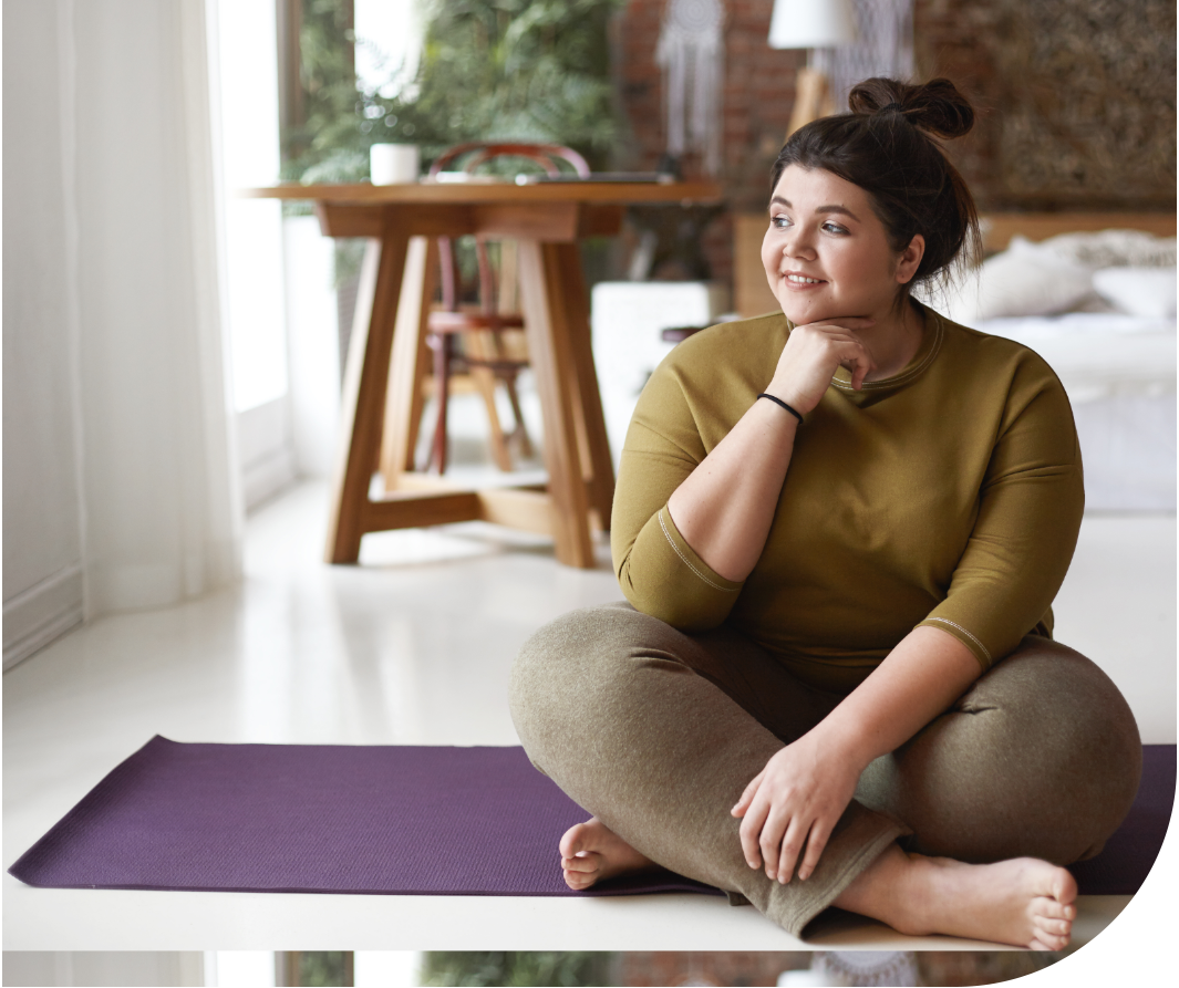Woman sitting in yoga pants pondering You take the custom-blended medicine once a week, but how exactly does it work?