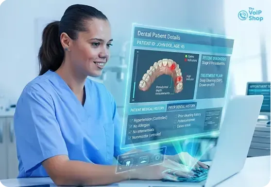 Dental Receptionist taking calls using deskphone