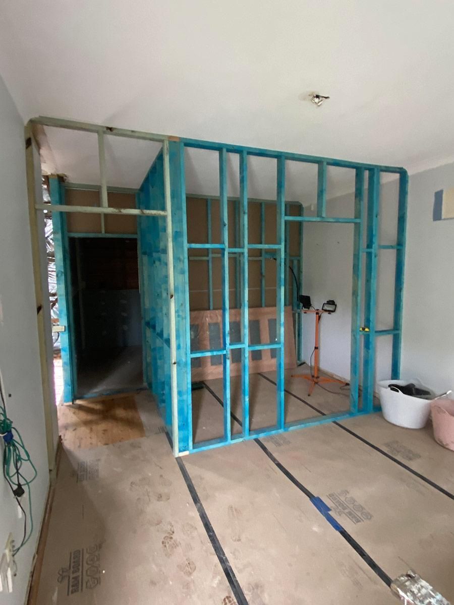 A Room With A Divider Made Of Blue Metal Frames — B Smart Building & Design In Shellharbour, NSW