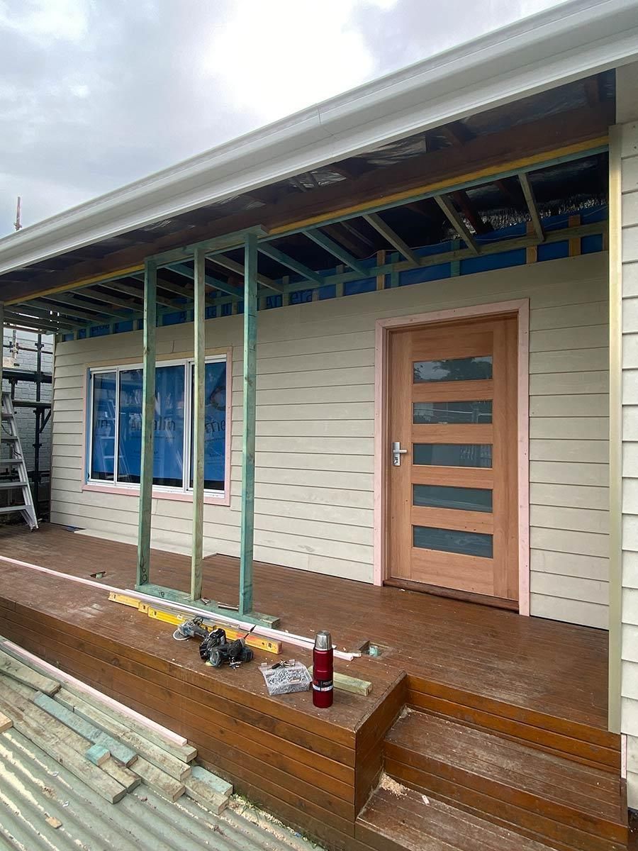 A House Is Being Built With A Porch And Stairs — B Smart Building & Design In Figtree, NSW