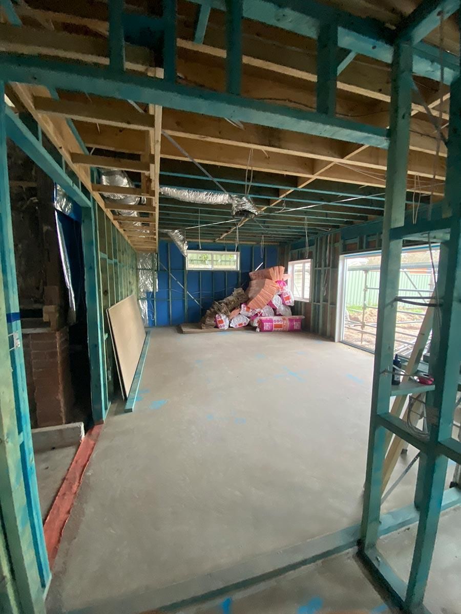 A Large Room In A House Under Construction With A Lot Of Wooden Beams — B Smart Building & Design In Wollongong, NSW