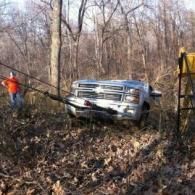 Pickup Truck Being Towed in Woods