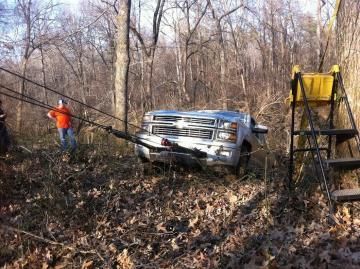 Pickup Truck Being Towed in Woods