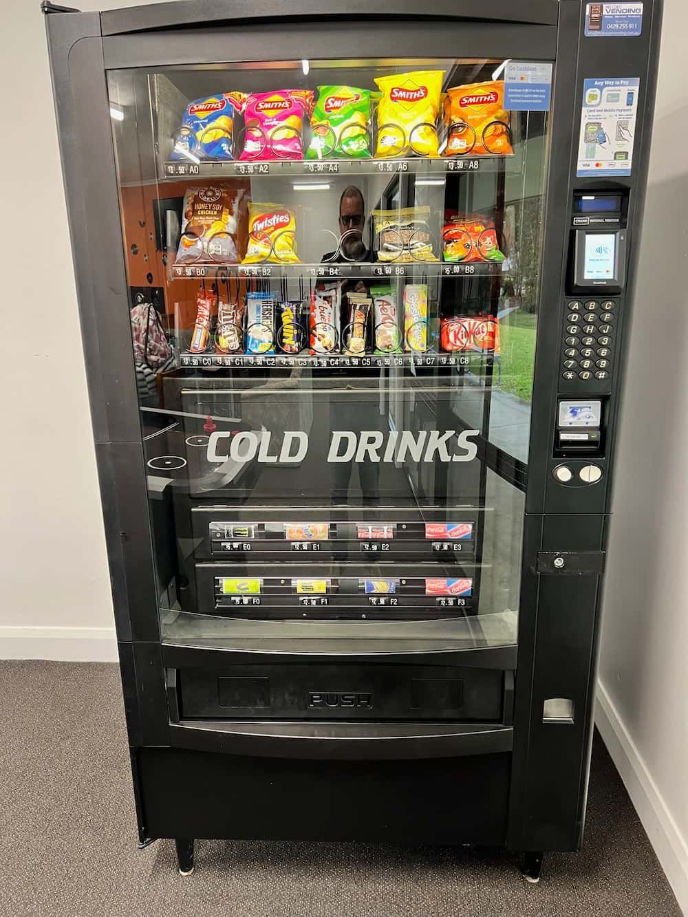 A Vending Machine Filled With Cold Drinks and Snacks — Central Coast Storage Solutions in Woolgoolga, NSW