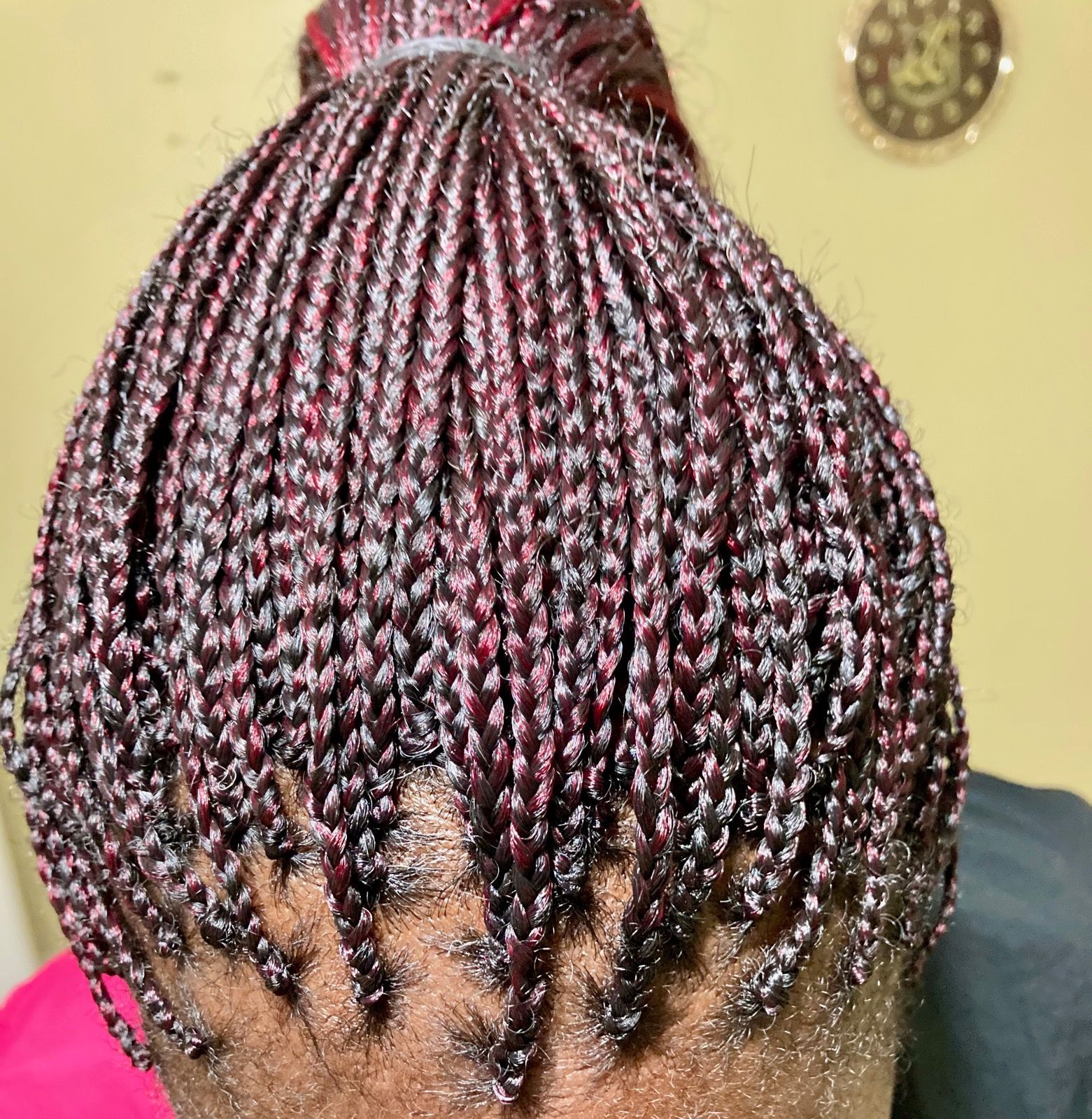 A Close Up Of A Woman Braided Hair In A Bun | Fayetteville, NC | Fatouisa African Braiding